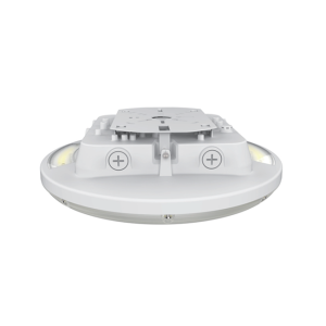 Bright LED TX round white industrial canopy lights surface mounted on a commercial parking garage ceiling.